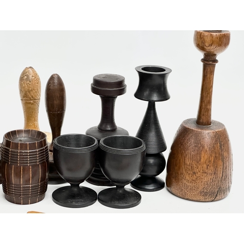 202 - A collection of 19th Century Treen Ware. Salt shaker, egg cups, butter pat, pestle etc