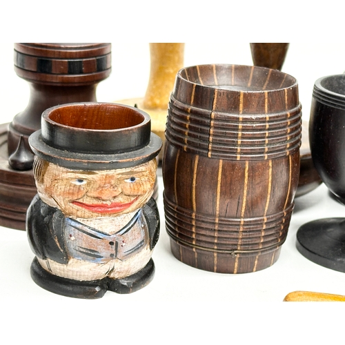 202 - A collection of 19th Century Treen Ware. Salt shaker, egg cups, butter pat, pestle etc