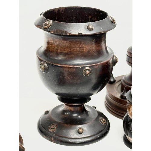 202 - A collection of 19th Century Treen Ware. Salt shaker, egg cups, butter pat, pestle etc