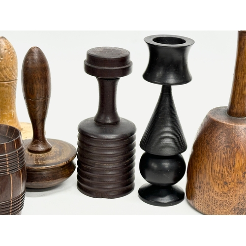 202 - A collection of 19th Century Treen Ware. Salt shaker, egg cups, butter pat, pestle etc