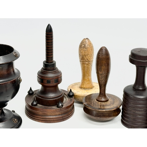 202 - A collection of 19th Century Treen Ware. Salt shaker, egg cups, butter pat, pestle etc