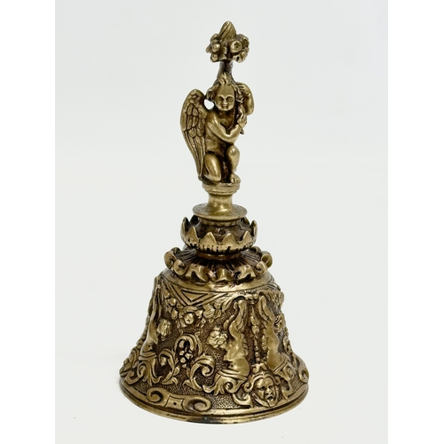 209 - 2 Late 19th Century brass and pewter bells. 16cm