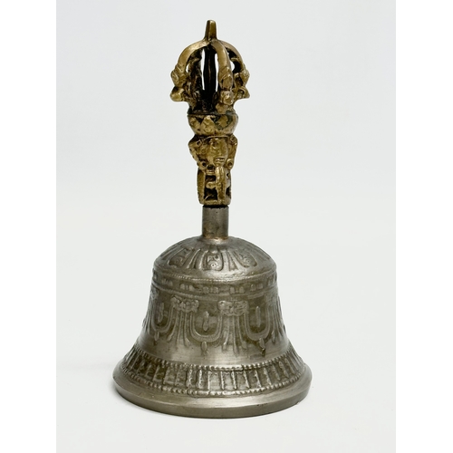 209 - 2 Late 19th Century brass and pewter bells. 16cm