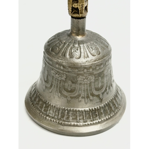 209 - 2 Late 19th Century brass and pewter bells. 16cm