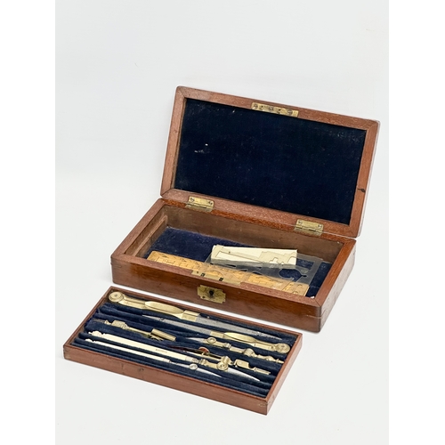 46 - A Late 19th Century Elliot Brothers bone and brass draughtsman’s set in mahogany case. 19.5x11x4.5cm