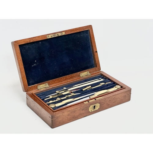 46 - A Late 19th Century Elliot Brothers bone and brass draughtsman’s set in mahogany case. 19.5x11x4.5cm