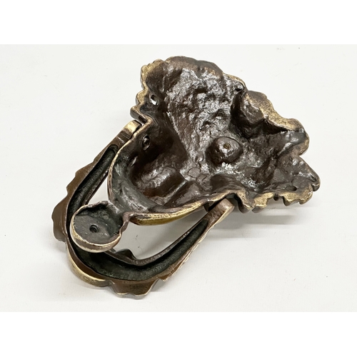 213 - A Late 19th Century Victorian brass ‘Dionysus’ door knocker. 18cm