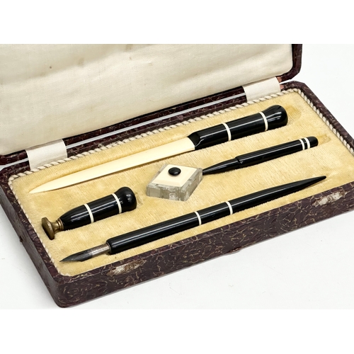 217 - An Early 20th Century pen set in case. With a C. Brandauer nib. Inkwell, seal, fountain pen, letter ... 