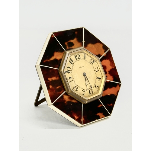 220 - An Art Deco faux tortoiseshell 8 Day desktop clock. 10x10cm