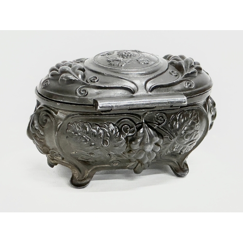 221 - An Early 20th Century Art Nouveau pewter trinket box. Circa 1900-1910. 11x7cm