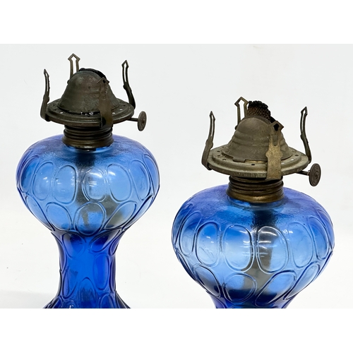 222 - A pair of Early 20th Century Bristol Blue glass oil lamps. 22cm