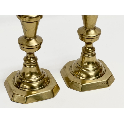 223 - A pair of large Victorian brass candlesticks. 27cm