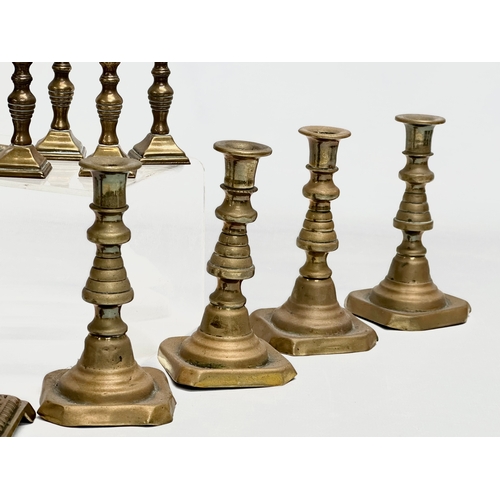 224 - 5 sets of Victorian brass candlesticks. 3 pairs and 2 sets of 4. 12cm, 11cm, 11.5. 6cm