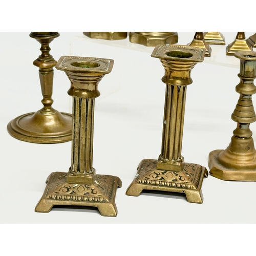 224 - 5 sets of Victorian brass candlesticks. 3 pairs and 2 sets of 4. 12cm, 11cm, 11.5. 6cm