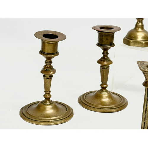 224 - 5 sets of Victorian brass candlesticks. 3 pairs and 2 sets of 4. 12cm, 11cm, 11.5. 6cm