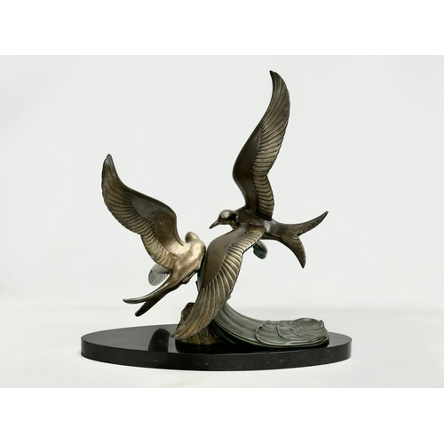 29 - A large 1920’s Art Deco ‘Paradis’ spelter figure on slate base. 47x45x50cm