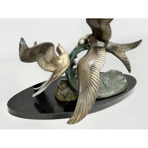 29 - A large 1920’s Art Deco ‘Paradis’ spelter figure on slate base. 47x45x50cm