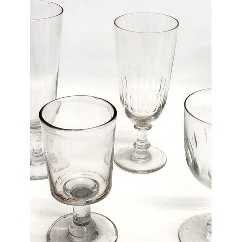 141 - A collection of large Mid 19th Century Victorian drinking glasses. 2 Victorian ale glasses 19cm. A V... 