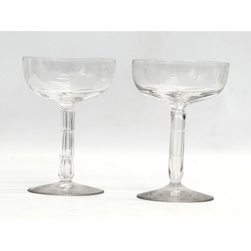 147 - Victorian champagne and wine glasses. A pair of Late 19th Century Victorian slice lens cut champagne... 