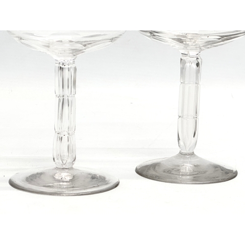 147 - Victorian champagne and wine glasses. A pair of Late 19th Century Victorian slice lens cut champagne... 