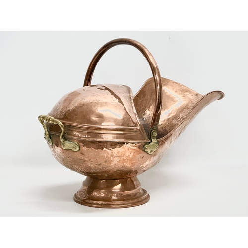 77 - A Victorian copper coal scuttle. 32x57cm