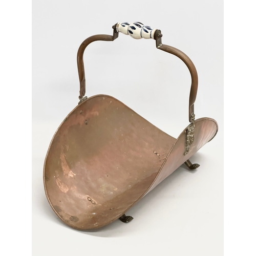 90 - A vintage copper log holder. 29x48cm