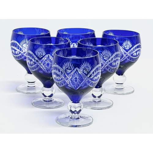 228 - A 7 piece 20th Century Bohemian blue crystal drinks set. Glasses 11cm. Decanter 29cm.