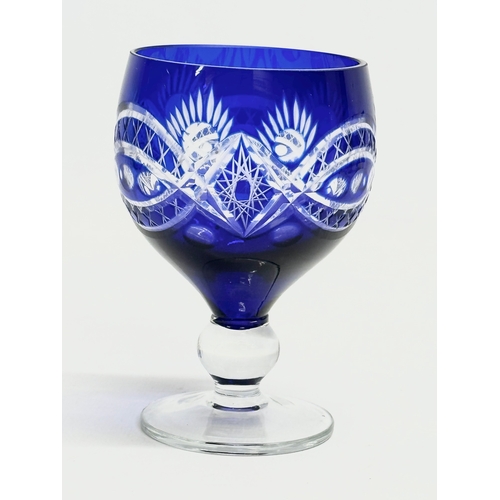 228 - A 7 piece 20th Century Bohemian blue crystal drinks set. Glasses 11cm. Decanter 29cm.