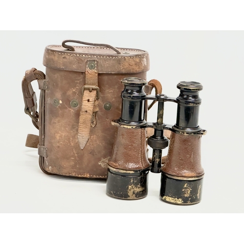 102 - A pair of WWI field binoculars with original leather case. G. Battle.