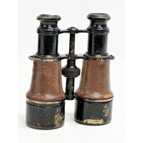 102 - A pair of WWI field binoculars with original leather case. G. Battle.