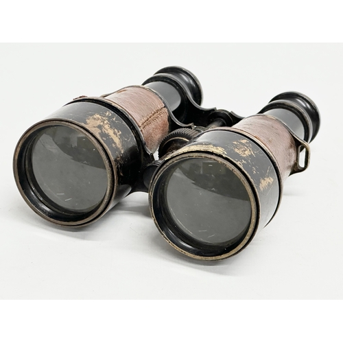 102 - A pair of WWI field binoculars with original leather case. G. Battle.