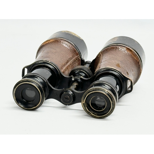 102 - A pair of WWI field binoculars with original leather case. G. Battle.