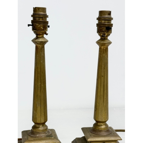 199 - A pair of vintage heavy brass table lamps. 29cm