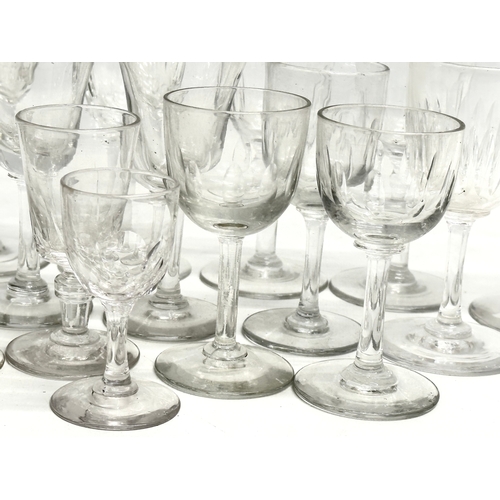 169 - A collection of Mid/Late 19th Century Victorian slice lens cut drinking glasses. 13cm. 12cm. 11cm. 8... 