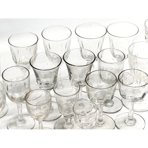 169 - A collection of Mid/Late 19th Century Victorian slice lens cut drinking glasses. 13cm. 12cm. 11cm. 8... 