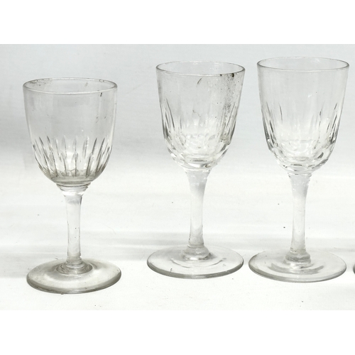 169 - A collection of Mid/Late 19th Century Victorian slice lens cut drinking glasses. 13cm. 12cm. 11cm. 8... 