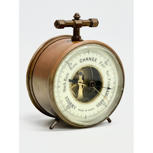 238 - A Late 19th/Early 20th Century French brass cased barometer. Made in Paris. Circa 1900. 8x5x9.5cm