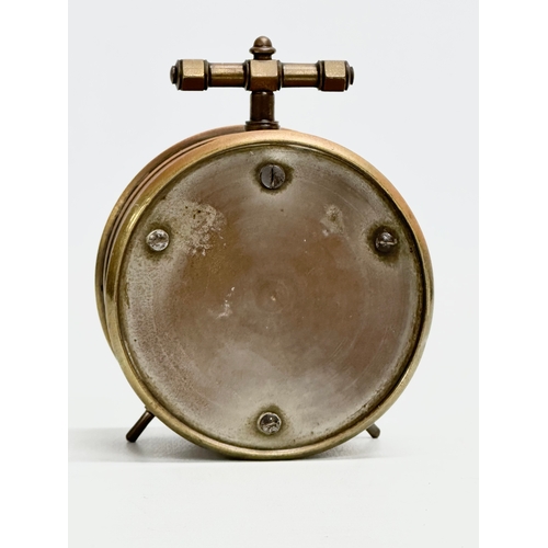 238 - A Late 19th/Early 20th Century French brass cased barometer. Made in Paris. Circa 1900. 8x5x9.5cm