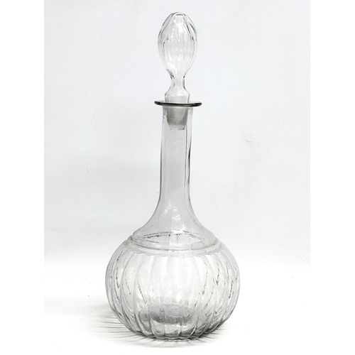 171 - 3 Mid 19th and Early 20th Century glass decanters. A large Mid 19th Century decanter 35cm.