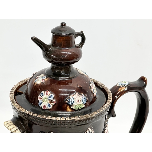 58 - A large Late 19th Century Measham Pottery ‘Bargeware’ teapot. Circa 1880-1890. Forget Me Not. 35x21x... 