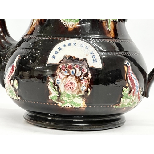 58 - A large Late 19th Century Measham Pottery ‘Bargeware’ teapot. Circa 1880-1890. Forget Me Not. 35x21x... 