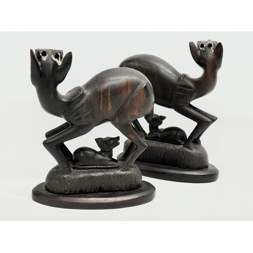 271 - A pair of Late 19th/Early 20th Century carved African Padauk deers. Circa 1900. 14x16cm