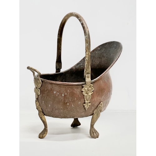 259 - An Early 20th Century copper and brass coal scuttle. Circa 1900. 24x38x34cm