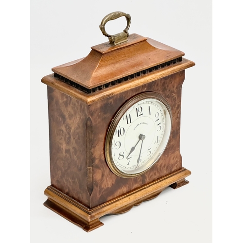 261 - An Early 20th Century Walker & Hall burr walnut mantle clock. French works. 16x8x21cm