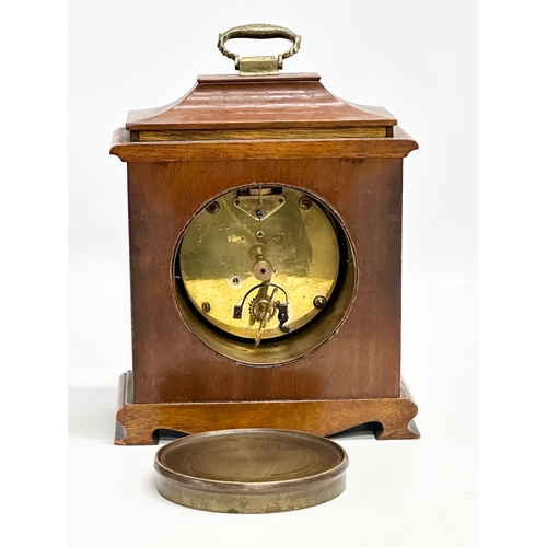 261 - An Early 20th Century Walker & Hall burr walnut mantle clock. French works. 16x8x21cm