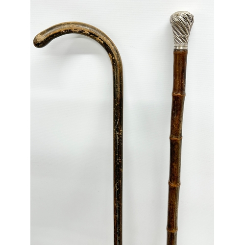 263 - A silver mounted walking stick and other. 94cm