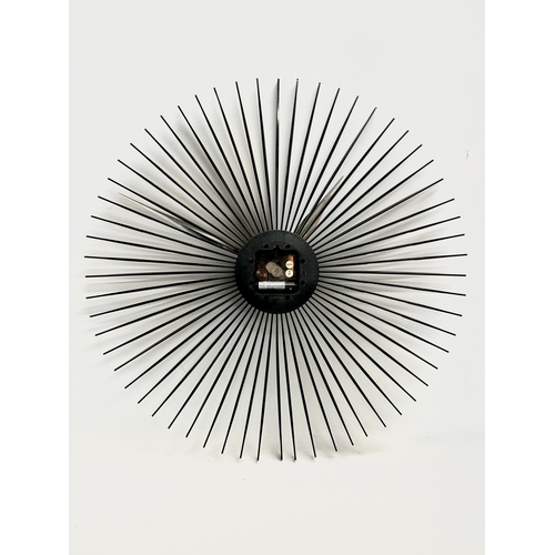 98 - A Mid Century sunburst wall clock. 50cm