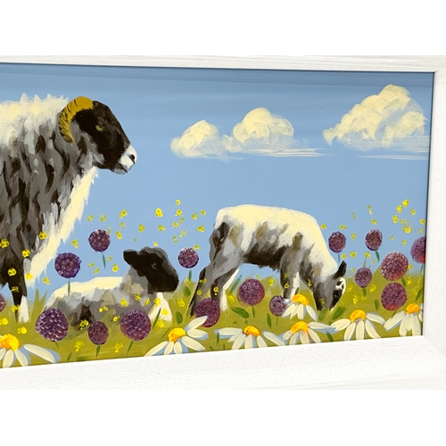 291 - An oil painting on board by Ron Keefer. Sheep in the Field. 75x29cm. Frame 87.5x41cm