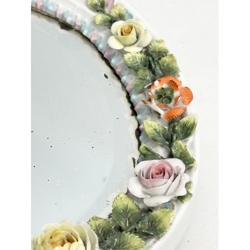 267 - A Late 19th Century German porcelain framed dressing mirror. 21x32cm