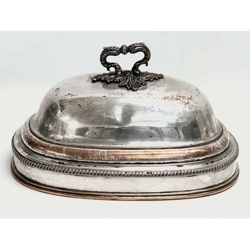 282 - An Early 19th Century silver plated meat dome by D&G Holy & Co. Circa 1805-1820. 34x25x20cm